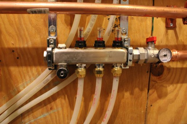 close up of valves on residential Navien tankless water heater