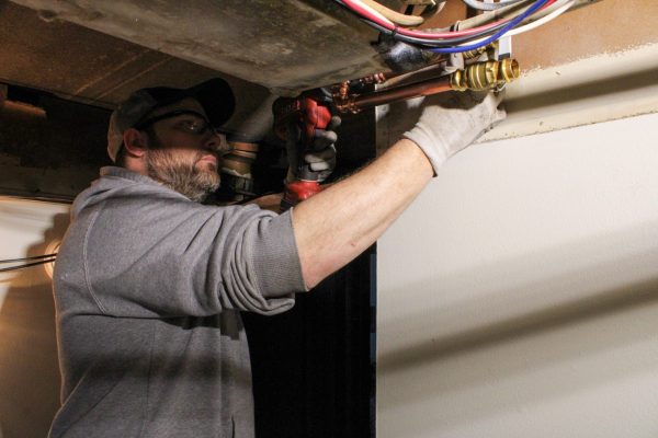 Schwickert's plumber installing pipes