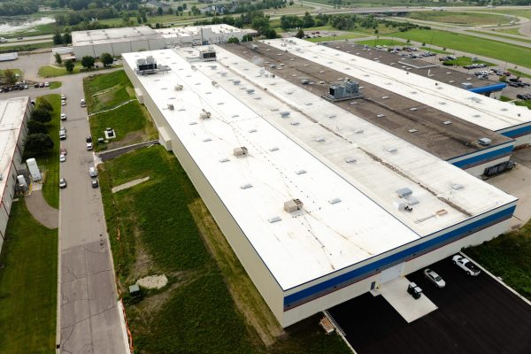 wide aerial view of a couple industrial buildings